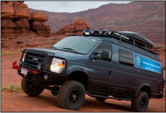 Dark blue Sportsmobile camper van rented by Adventure Rentals.