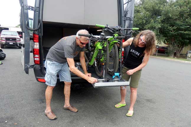 Exteior view of upgraded slide out bike tray in a custom Sportsmobile van conversion.