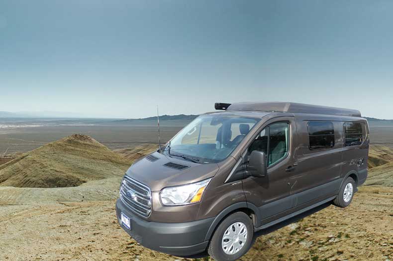 Brown Transit camper conversion van with the Penthouse top up.