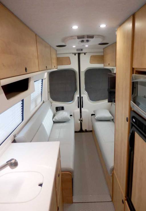 Ford Transit camper conversion with full walkway.