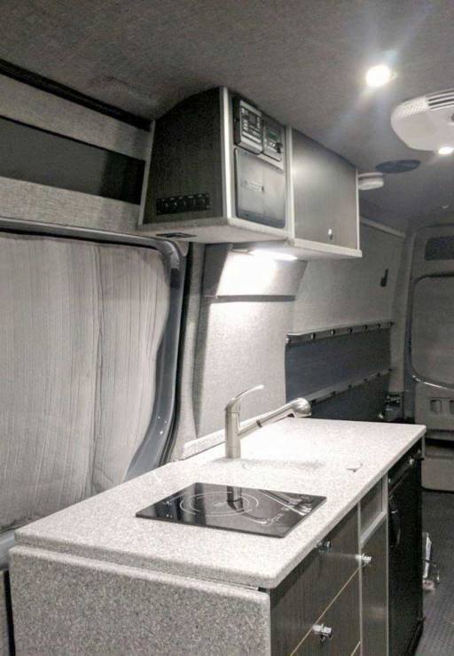 Galley includes cooktop stove and refrigerator