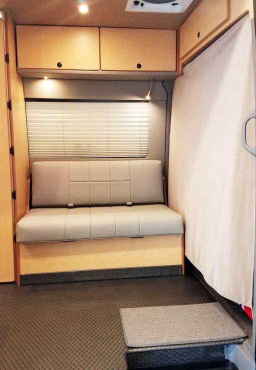 The small gaucho can convert into a single bed. A cab privacy curtain is included.