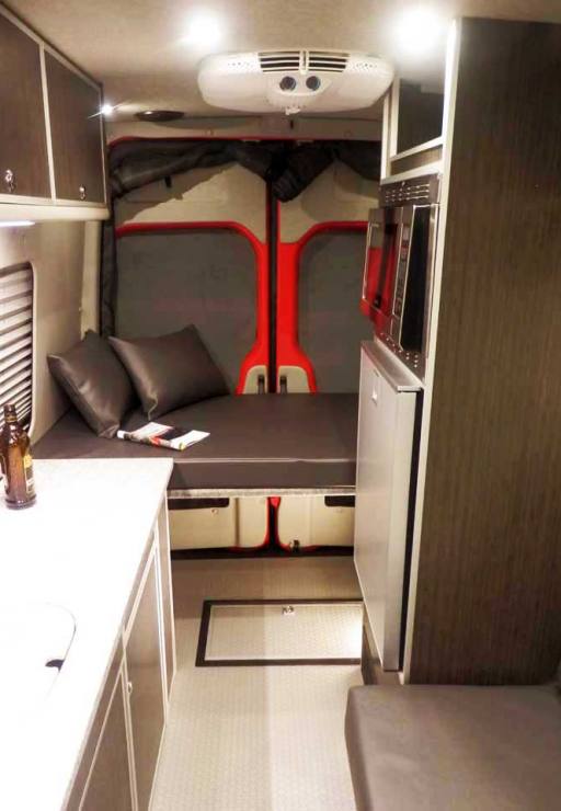 Interior view of a custom Sportsmobile Sprinter 4x4 van conversion.