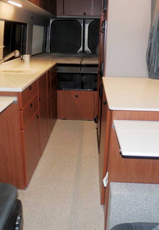 Interior view of a Sportsmobile Sprinter EB custom camper van conversion.