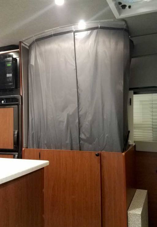 Interior shower view of a Sportsmobile Sprinter EB custom camper van conversion.