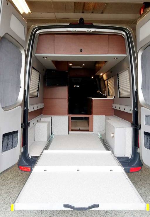 Rear view of a Sportsmobile Sprinter EB custom camper van conversion.