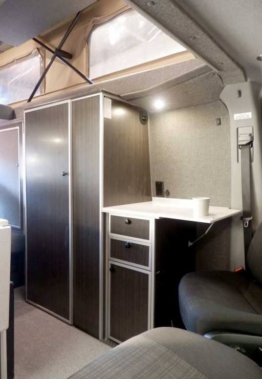 Custom Red RB-50M Sportsmobile Sprinter with interior galley.