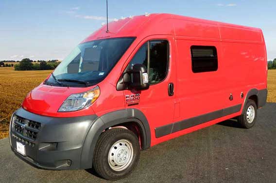 Red Dodge ProMaster camper van conversion.