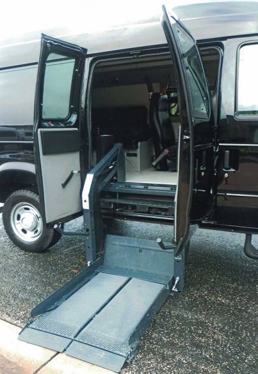 Sportsmobile Disabled Transit 4x4 with hydraulic ramp system in down position.