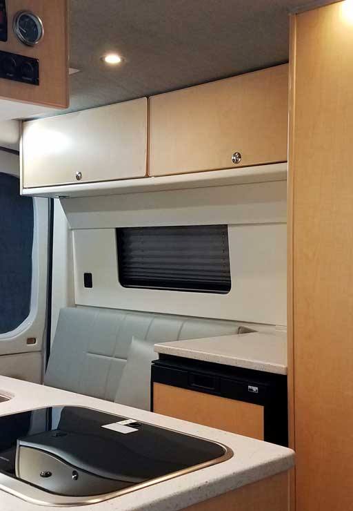 Interior view of spacious area inside this van conversion.