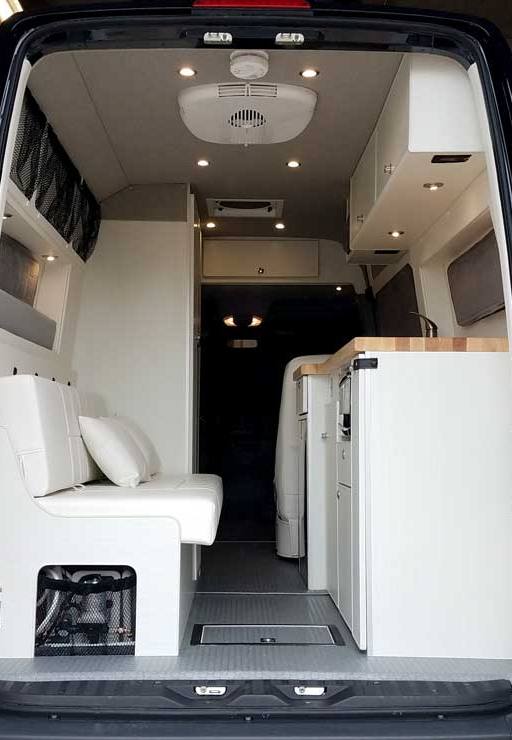 Custom Sprinter conversion van with convertible gaucho/bed.