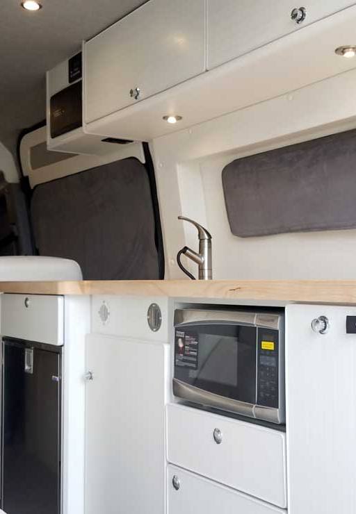 Custom Sprinter conversion van with a long galley.