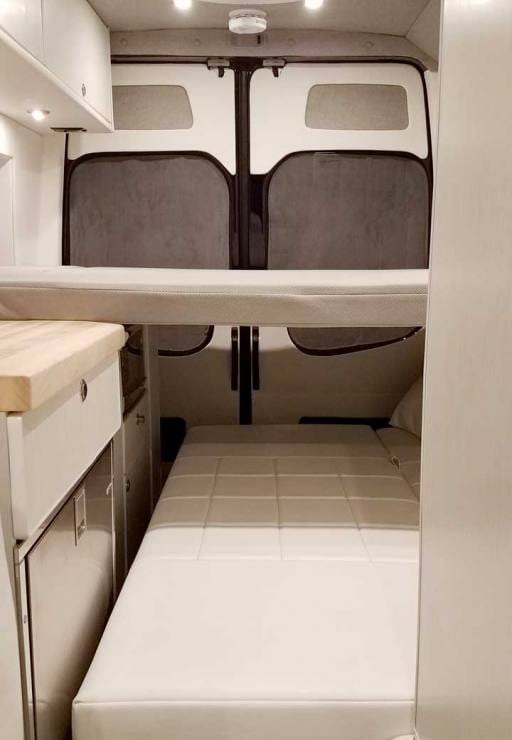 Custom Sprinter conversion van with a removable platform bed.