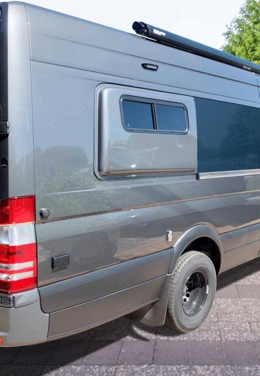 Van conversion with fiberglass flares.