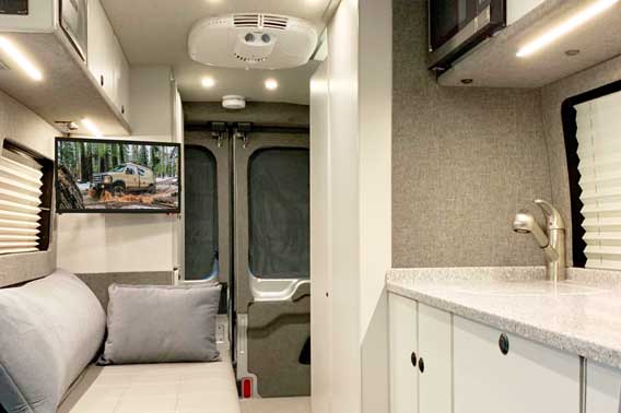 Van conversion with modern interior and amenities.