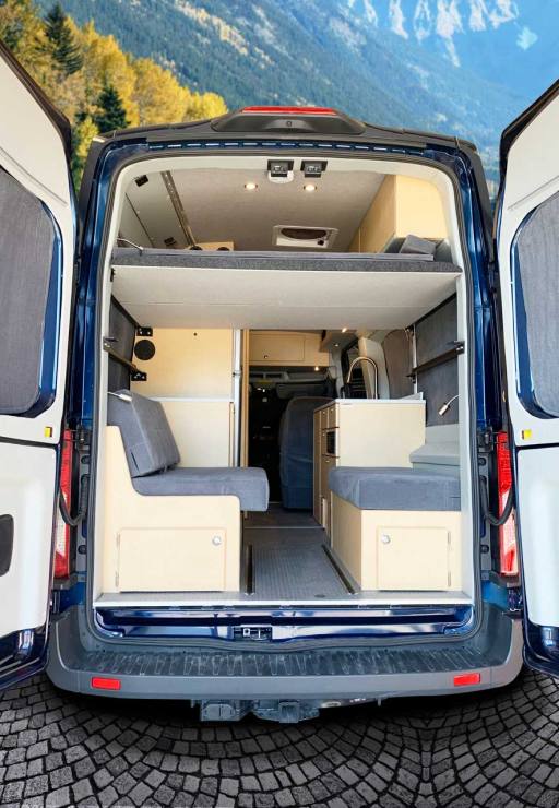 Platform bed in rear of conversion van.