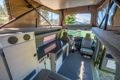 Sportsmobile 4×4 Van Conversion interior penthouse pop top view.